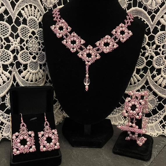 Renaissance necklace, bracelet and earrings made from pink pearls and crystals.
