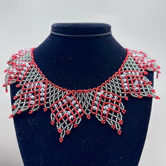 A lace collar necklace made from seed beads.