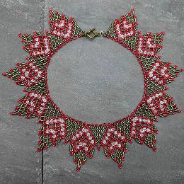 A photo of a lace necklace made from seed beads.