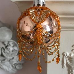 Orange swags and tails bauble