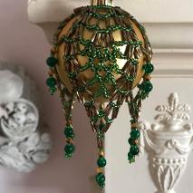 Pineapple beaded bauble ornament made with green seed beads and bronze bugle beads.