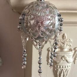 Pineapple bauble in pale pink and silver on a matt silver Christmas tree bauble.