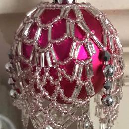 Pineapple beaded bauble made in pale pink and silver on a fuchsia glass ball Christmas tree ornament.