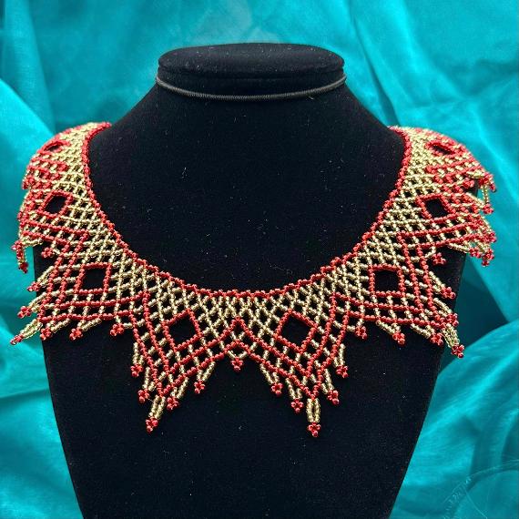 A lace collar necklace made from seed beads.
