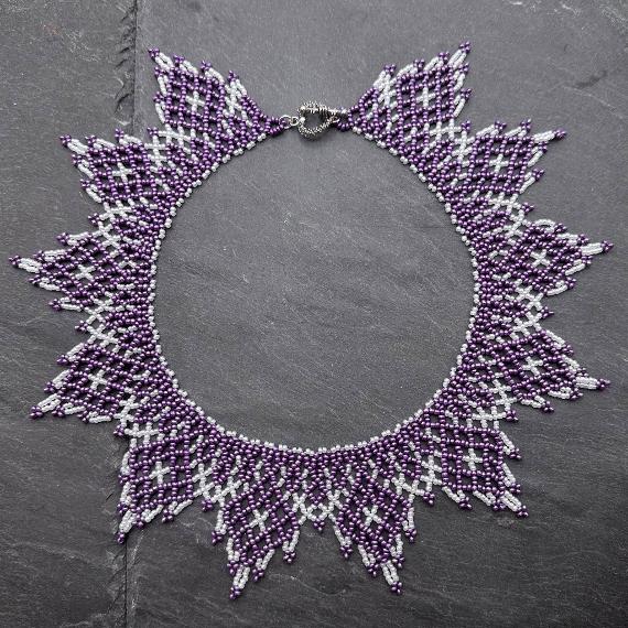 A lace collar necklace made from seed beads.