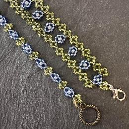 Two blue and green beaded bracelets.