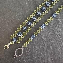 Two blue and green beaded bracelets.