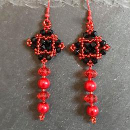 Red and black tudor square earrings.