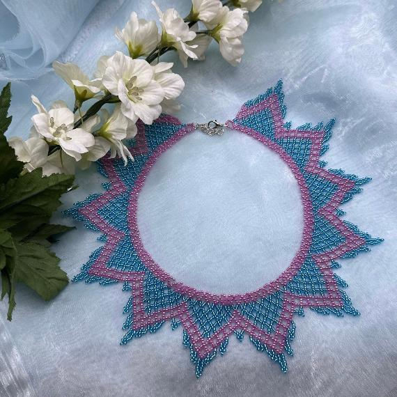 A lace collar necklace made from seed beads.