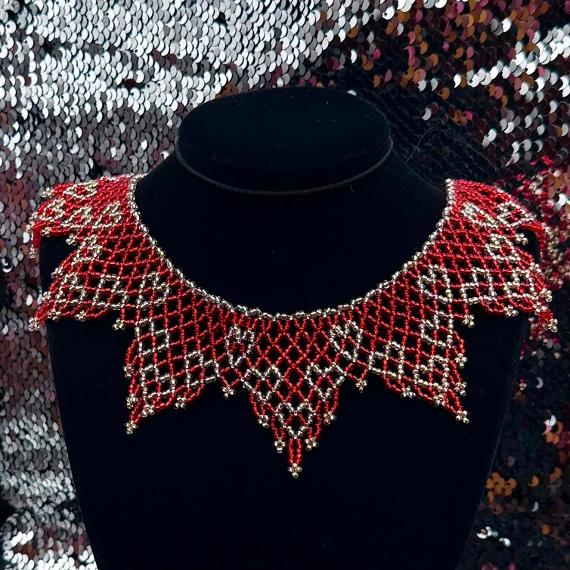 A lace collar necklace made from seed beads.