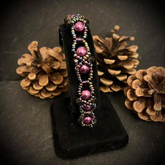 Heather bracelet made from purple pearls and crystals.
