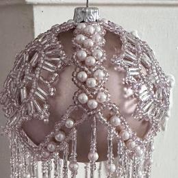 Close up view of pink Khione bauble seen from the side.