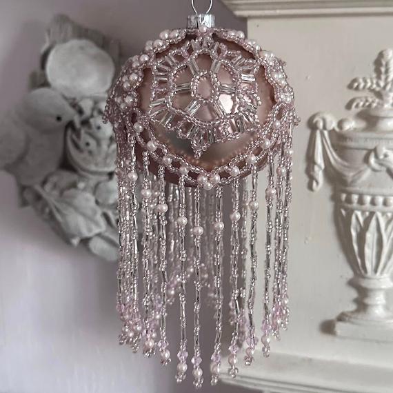 Khione bauble. Pink beads on a pink bauble.