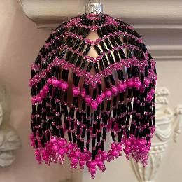 Lumiere bauble. Hot pink and black beads on a Christmas tree ornament.