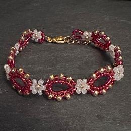 Red bracelet on a slate.