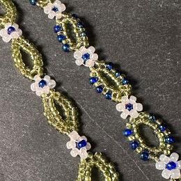 A close up photo of two green bracelets.