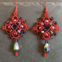Persephone earrings mde in shades of red and purple chosen to represent a pomegranate colour.