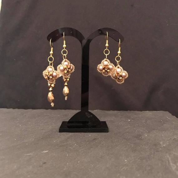 Two pairs of gold earrings form the Lady Victoria jewellery pattern. They are both the same shape then one has had crystal teardrops added.