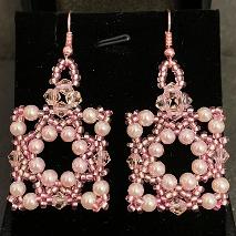 Renaissance earrings made from pink pearls and crystals.