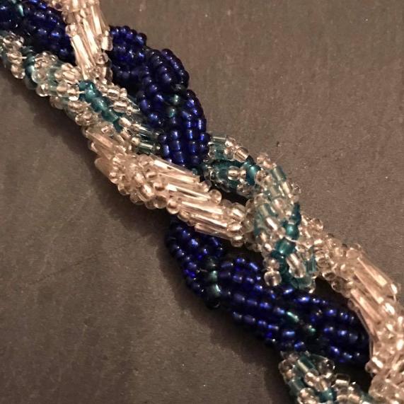 Three spiral ropes in different colours and using different beads, plaited together.