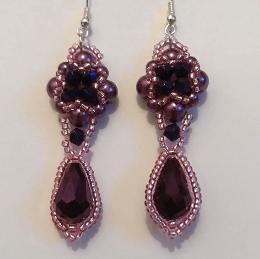 Dark purple Hulton Abbey earrings on a white background.