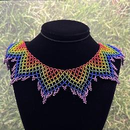 A photo of a lace necklace made from seed beads.