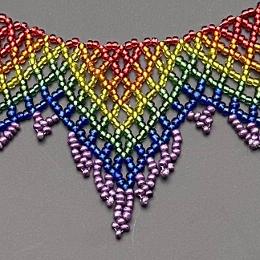 A close up photo of a beaded lace necklace.