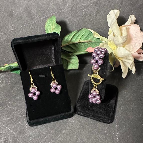 Right angle weave bracelet and earrings made from purple pearl beads.