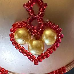 Red and gold bead heart.