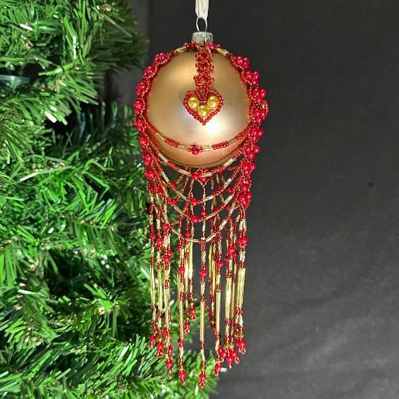 I Love Christmas bauble. Red and gold beads on a gold bauble.