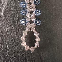 A close up view of a bead toggle clasp.