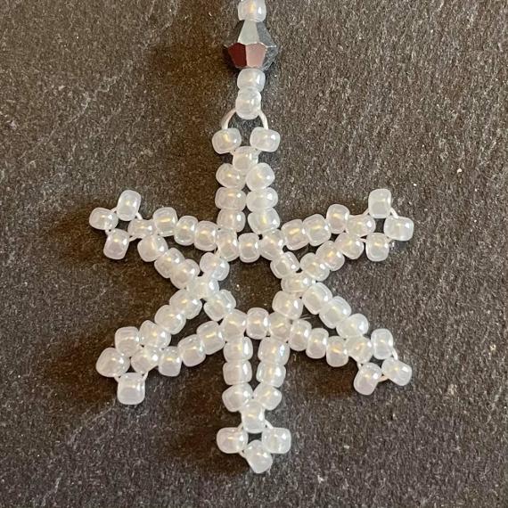 Snowfall bauble. This is a decorative cover that goes over a Christmas tree bauble ornament.