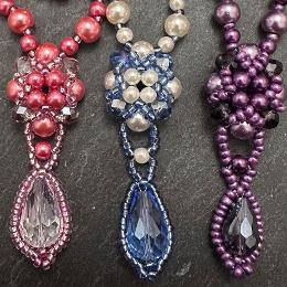 Close up view of three different colour drop motifs.