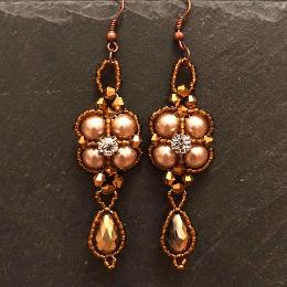 Gold thundercloud earrings.