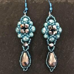 Hulton Abbey earrings made from pale turquoise pearls with silver metallic crystals.
