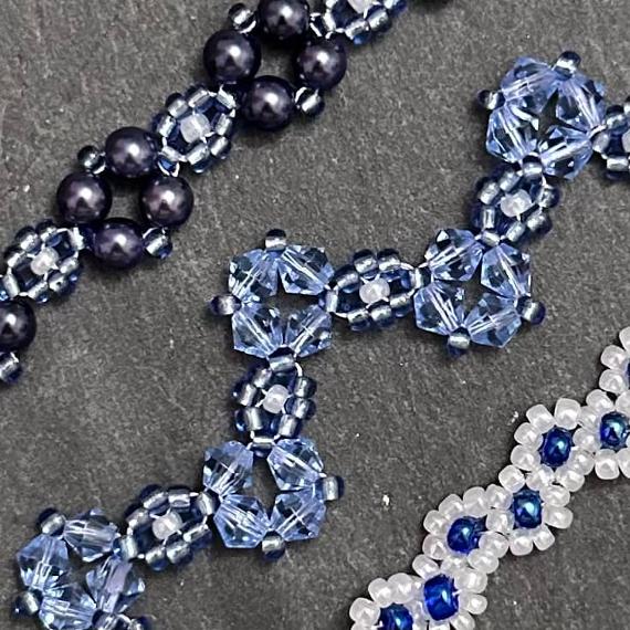 A close up view of three blue bracelets.